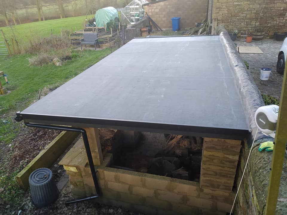 GRP fibreglass flat roof being installed